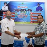 Di dampingi Ketua PKK, Hamid Rizal Salurkan Bantuan Pangan, Rapid Test dan APD di Bunguran Batubi Di dampingi Ketua PKK, Hamid Rizal Salurkan Bantuan Pangan, Rapid Test dan APD di Bunguran Batubi